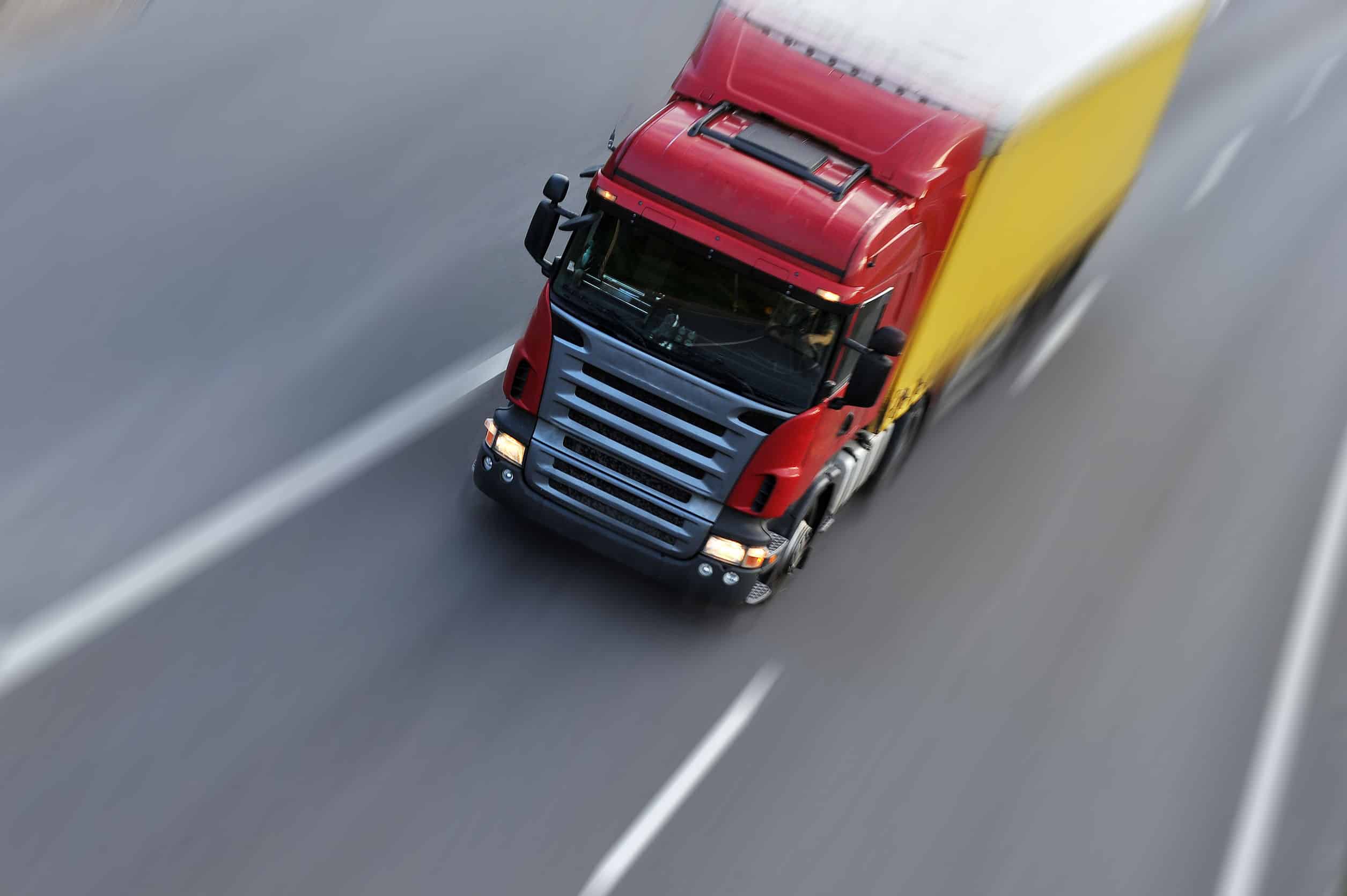 25074046 – truck with freight moving fast