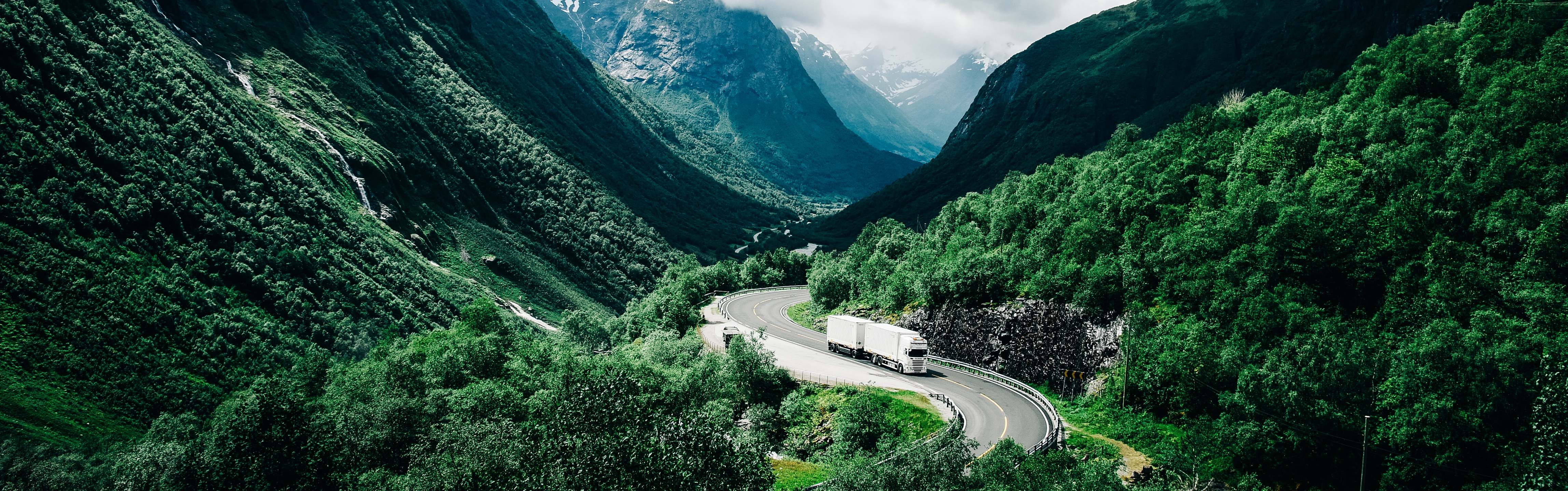 A Volvo truck driving in mountains